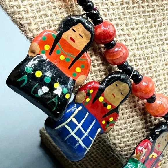 Vintage Colorful Guatemala Beaded Necklace featuring Clay Doll Charms